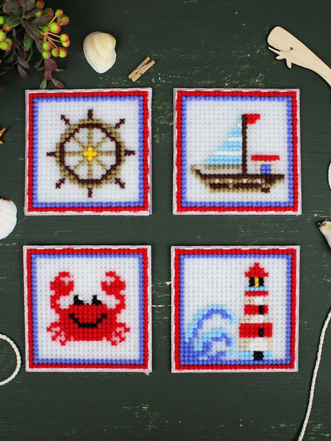 Kūrybinis siuvinėjimo kryželiu rinkinys „Jūros šauksmas“ – 4 jūriniai paveikslėliai vaikų kambario dekorui, 10,6 x 10,6 cm